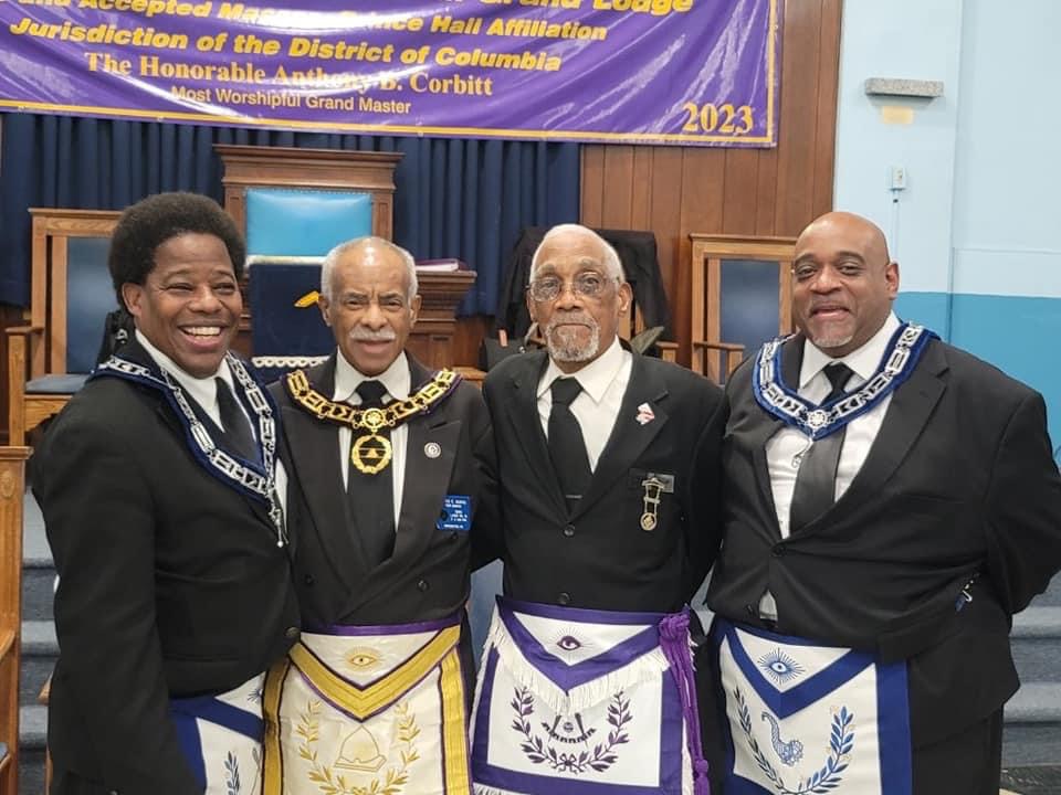 Four men in formal attire