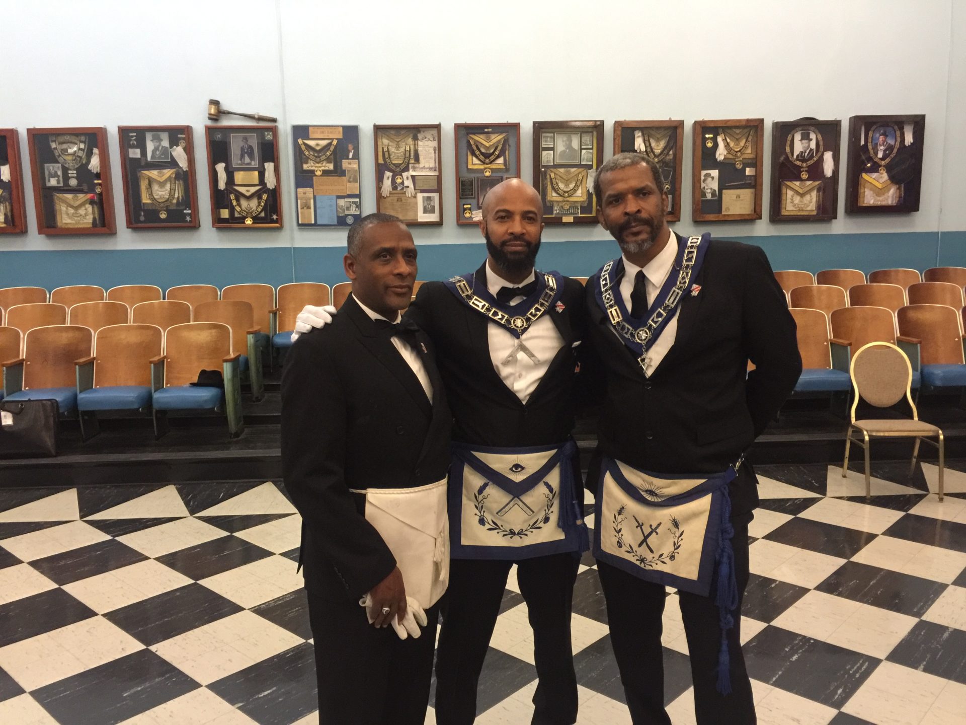 Three men in formal attire