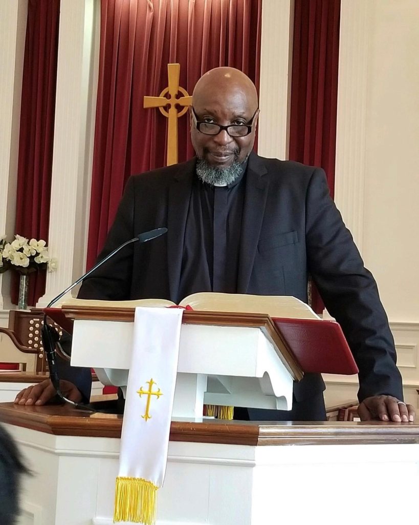 Pastor at lectern in church