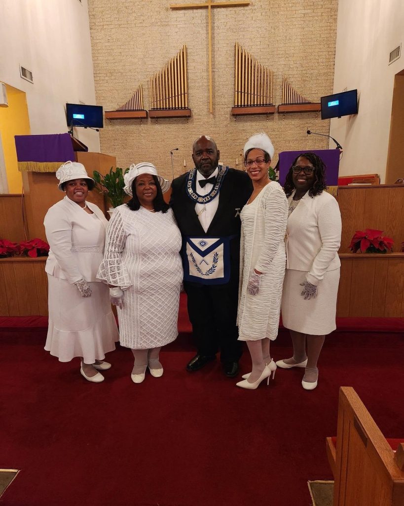 Group in white formal attire